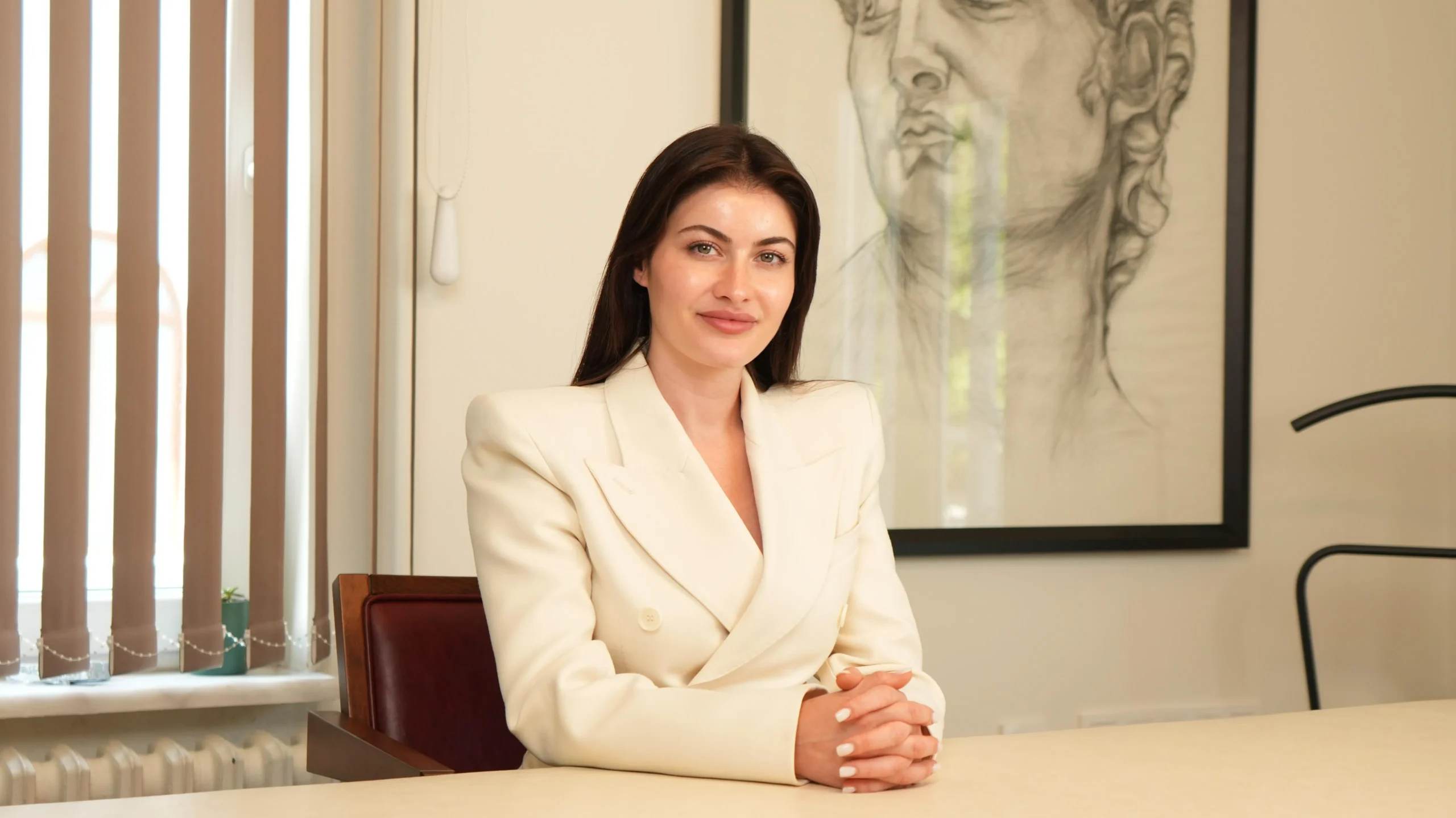 Merve Akkaya seated at her desk