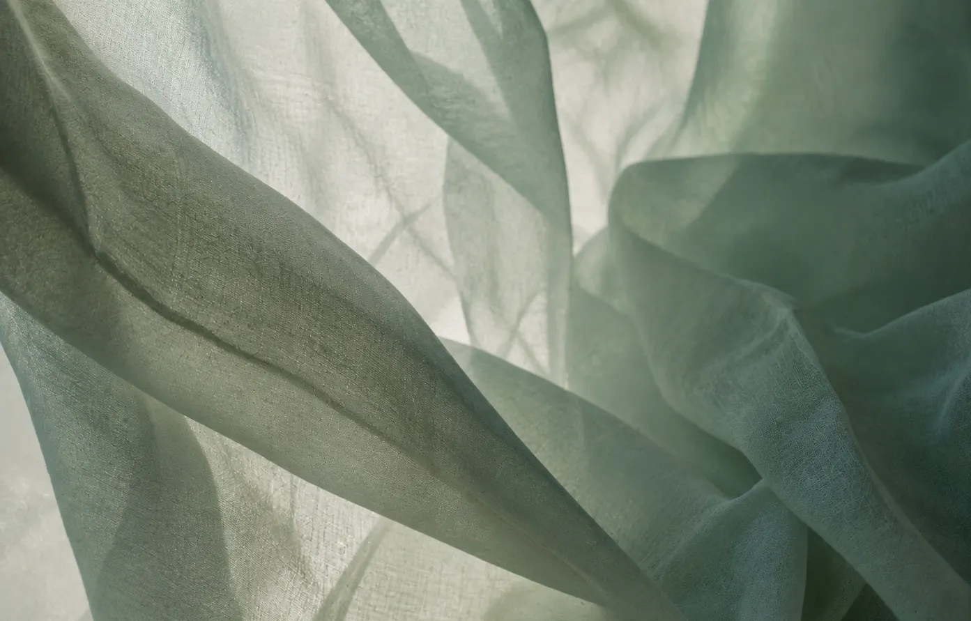 Layers of softly folded green fabric