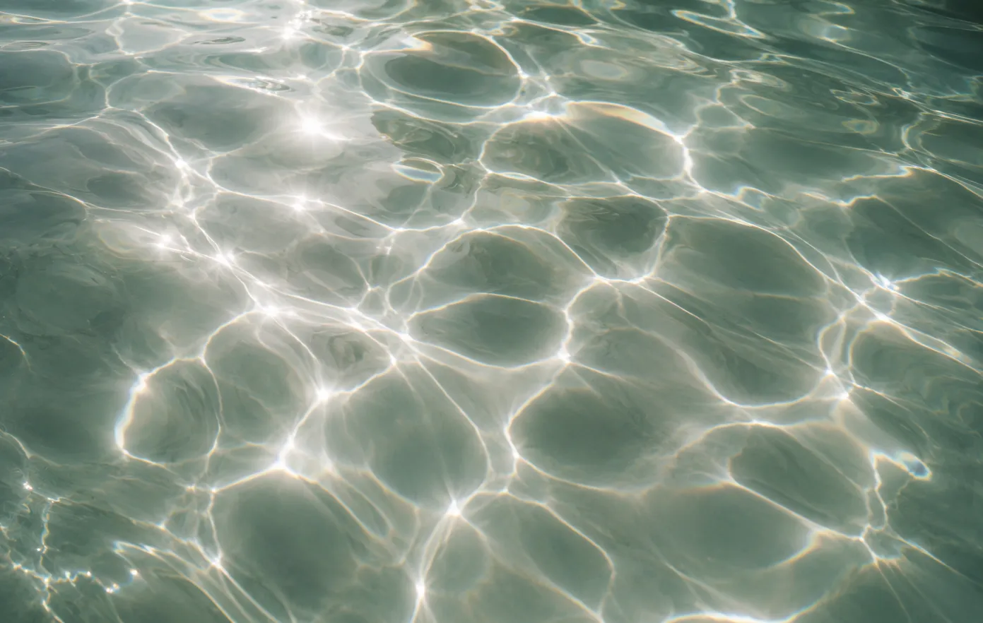Sunlight moving across clear water